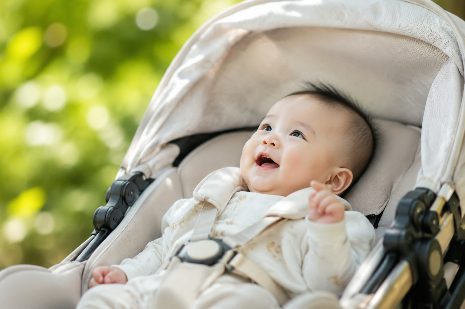 A highly realistic photo of a cute 6-month-old Chinese baby lying in a baby stroller, looking up happily and curiously at the lush green tree leaves and dappled sunlight filtering through the canopy. Bright and soft natural early summer lighting, outdoors in a beautiful park, high detail, 8k resolution, shot with an 85mm portrait lens, bright, warm and airy color grading.