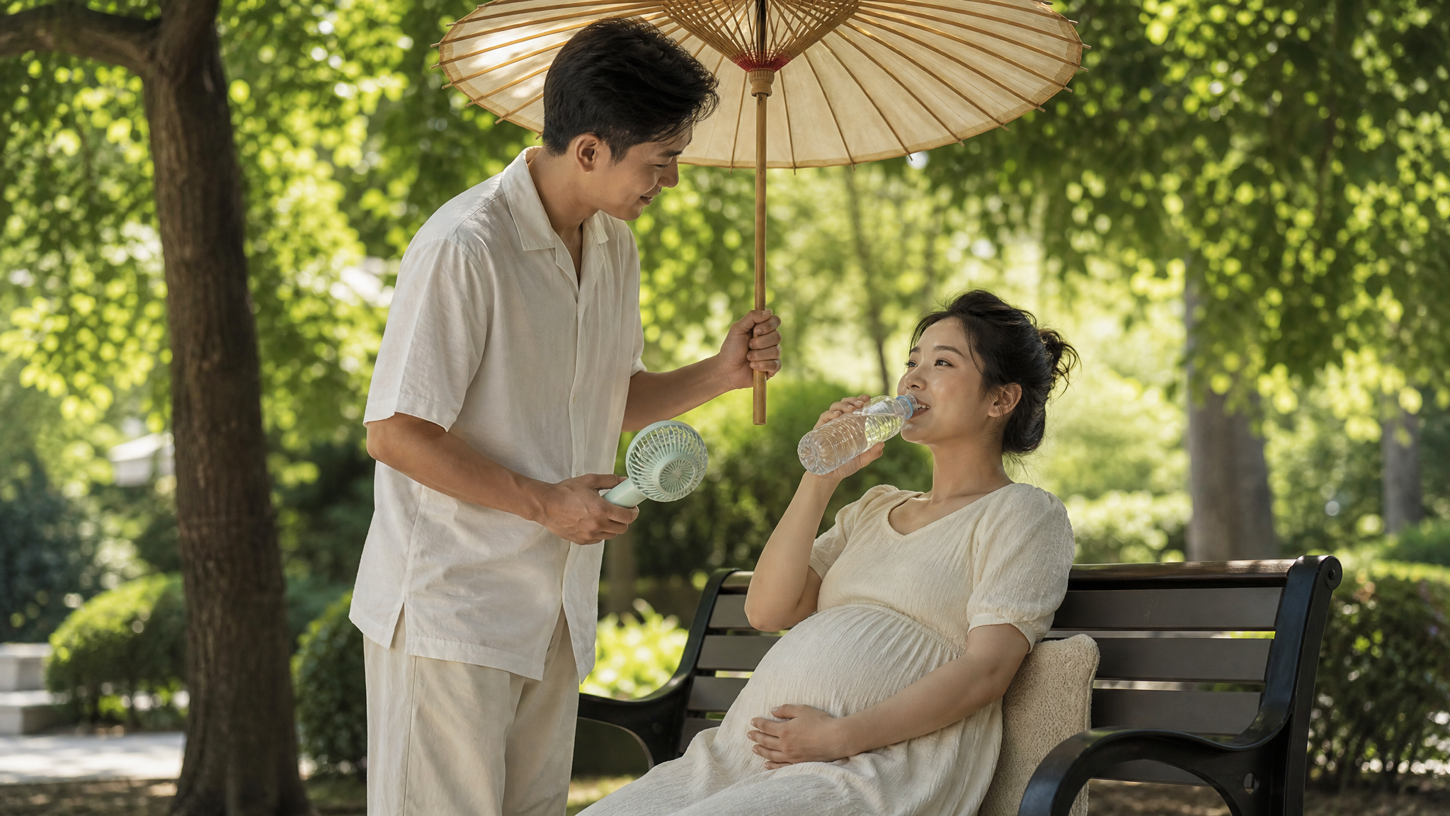 A heartwarming scene of a Chinese husband taking care of his pregnant wife outdoors in the shade during summer. The husband is holding a parasol and a mini fan for her. The wife is smiling comfortably and drinking water from a bottle. Soft natural lighting passing through tree leaves, highly detailed, realistic, warm and loving atmosphere, 8k, Midjourney v6.