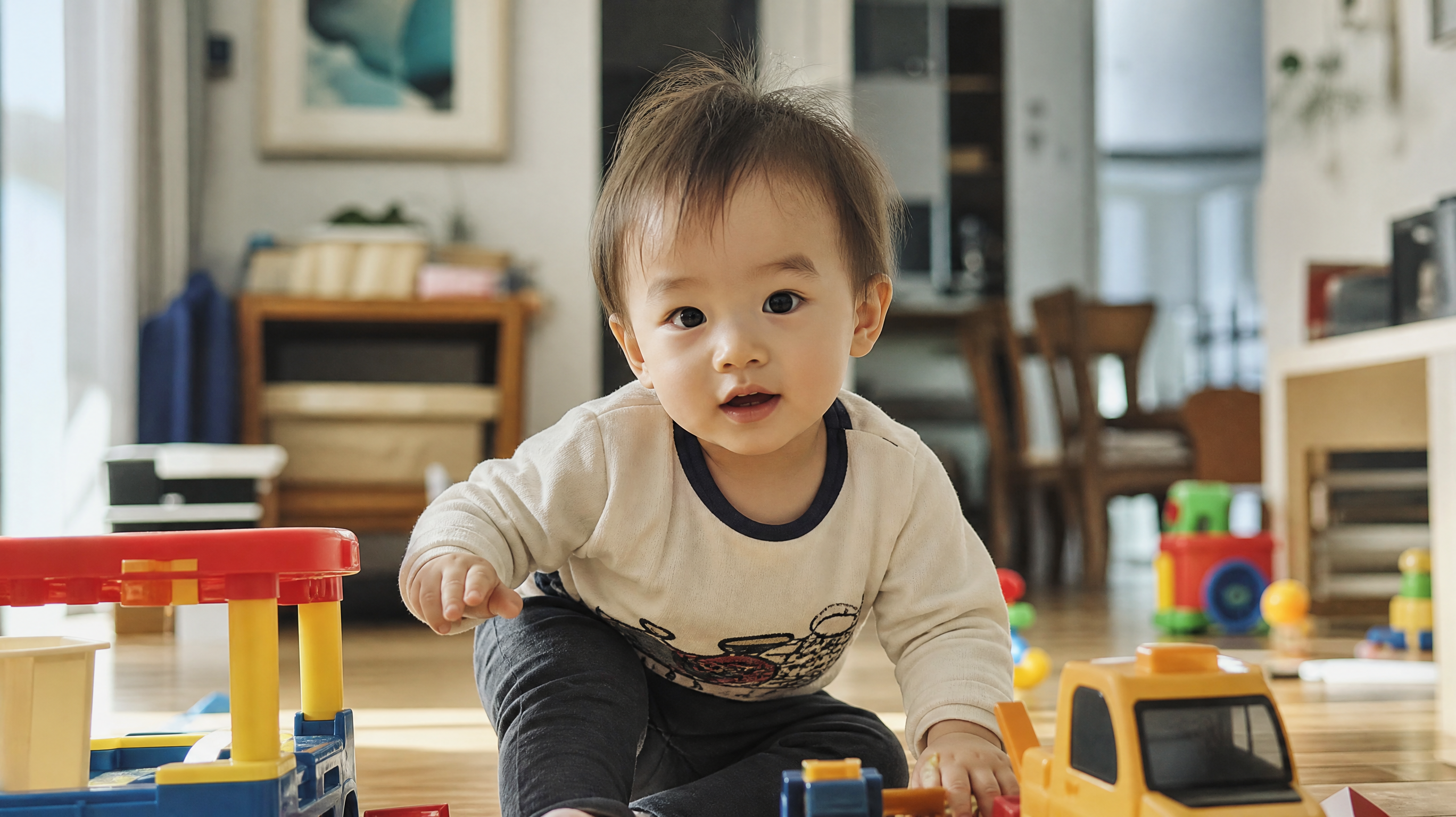 A cute 1.5-year-old Chinese toddler playing energe