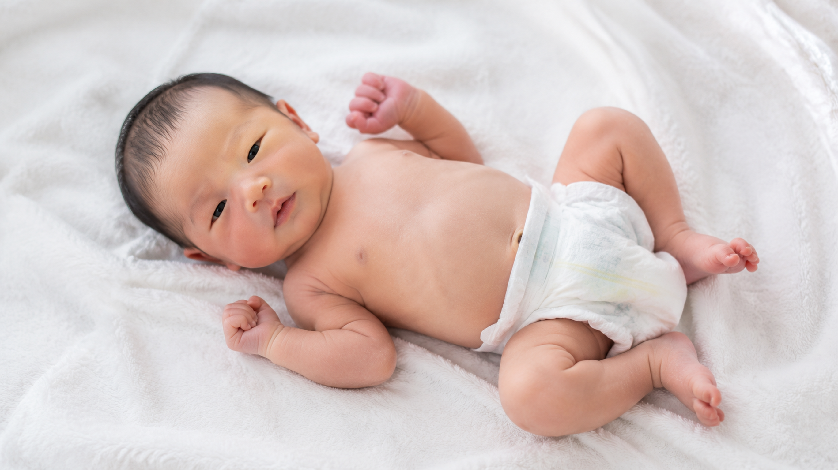 A close-up realistic photo of a Chinese newborn ba