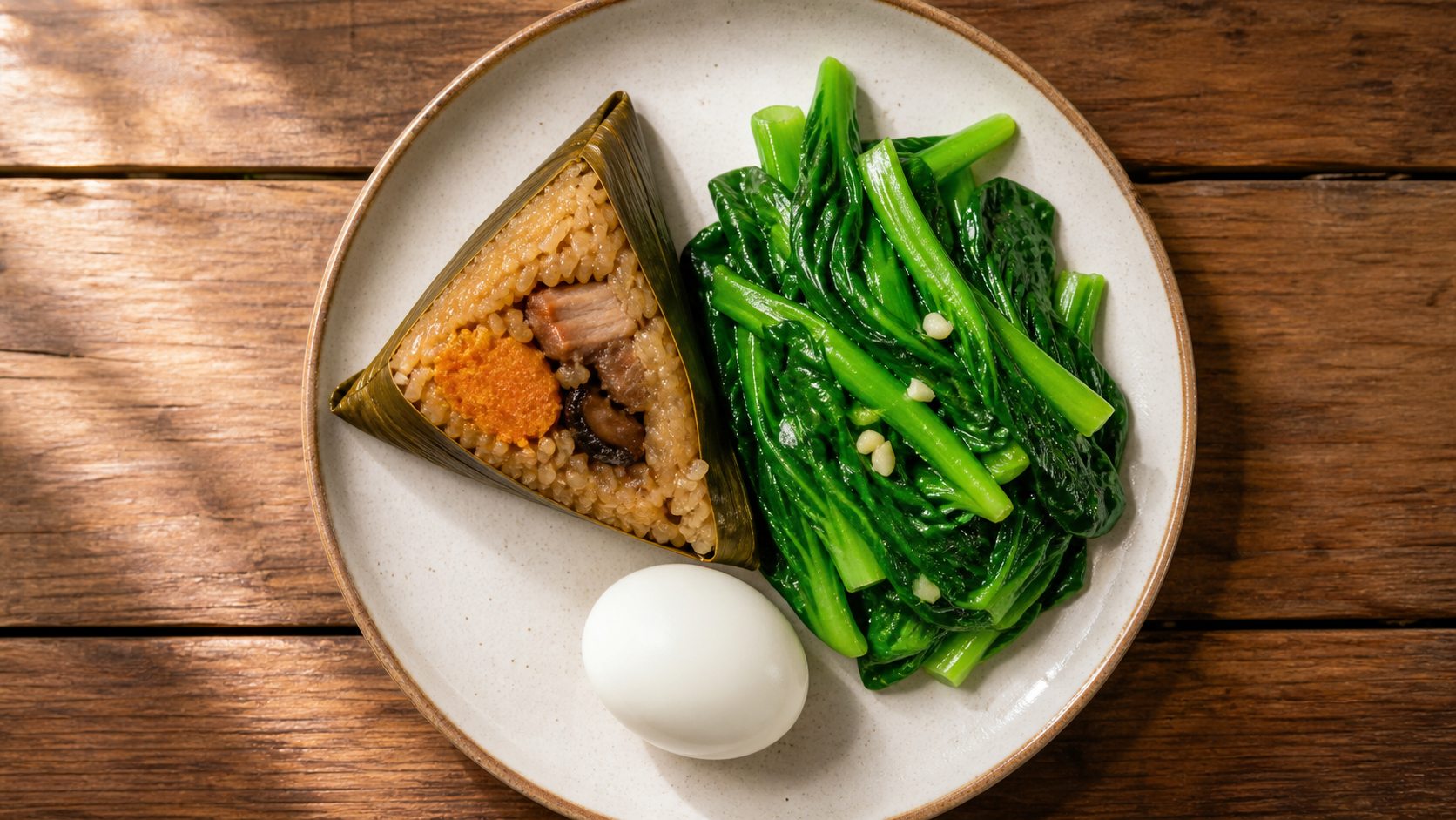 A healthy balanced meal plate on a wooden table, c