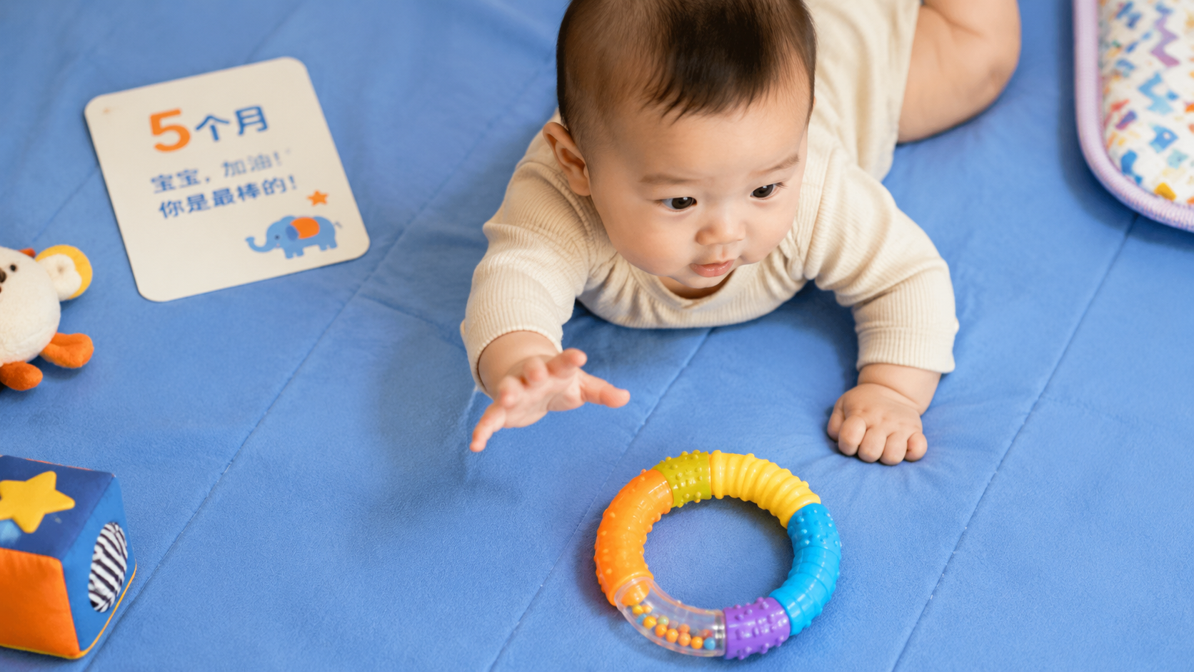 Top-down view of a 5-month-old Chinese baby lying 