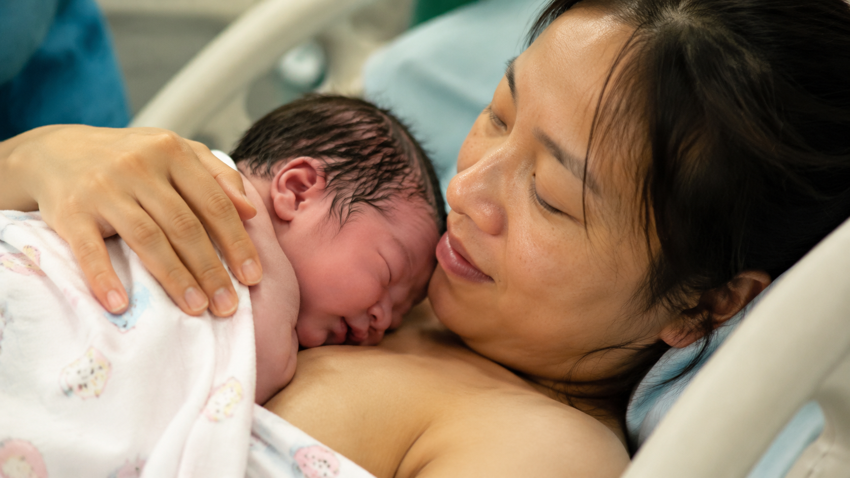 A heartwarming close-up shot of a Chinese newborn 